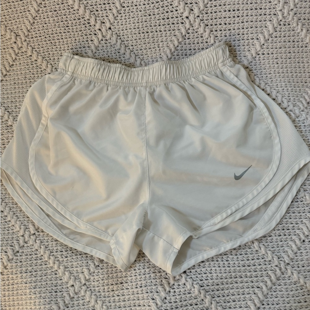 white Nike running shorts; small